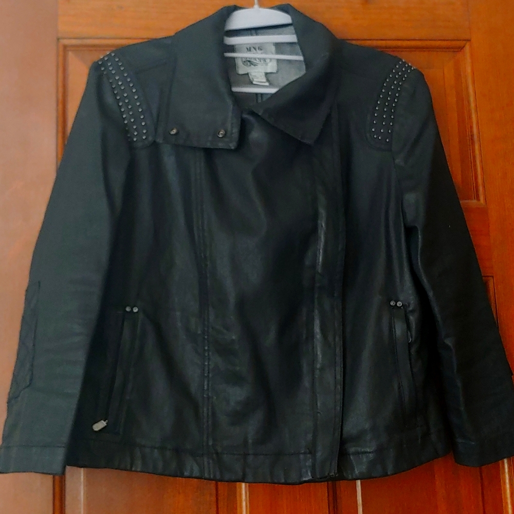 Black denim jacket. Little studs on the shoulders.